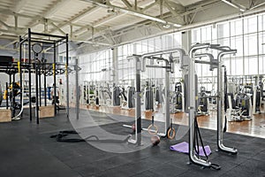 Interior of modern gym with equipment.