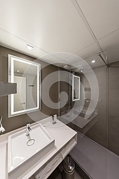 Interior of a modern hotel bathroom with a mirror