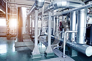 The interior of a modern industrial gas boiler room. Pipelines,