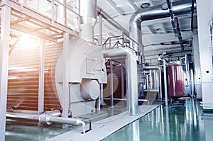 The interior of a modern industrial gas boiler room. Pipelines,