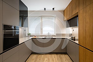 Interior of modern kitchen with built in appliances