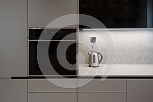 Interior of modern kitchen with built in appliances