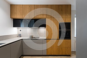 Interior of modern kitchen with built in appliances