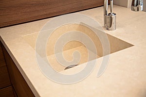 Interior of modern kitchen and ceramic sink and tap