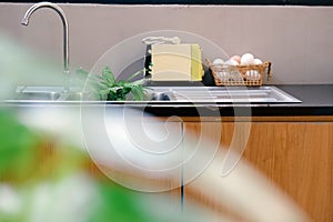 Interior of modern kitchen with sink