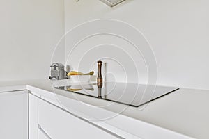 Interior of modern kitchen with white furniture