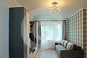 Interior of the modern living room with black and white furnishings