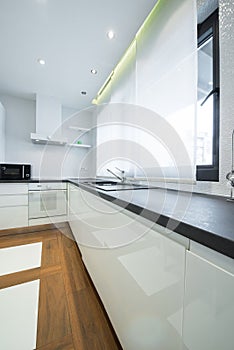 Interior of a modern luxury bright white kitchen