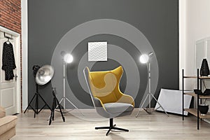 Interior of modern photo studio with armchair