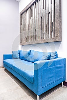 interior of modern waiting room with blue sofa