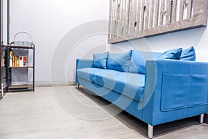 interior of modern waiting room with blue sofa