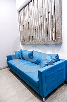 interior of modern waiting room with blue sofa