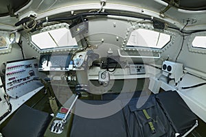 Interior of a new armoured personnel carrier seats, wheel, dashboard