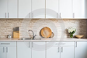 Interior of new bright white home kitchen