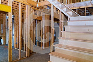 Interior of a new home wooden beams at construction residential house framing