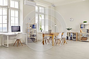 Interior of a new modern empty large business office, which is well lit by daylight.