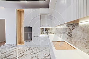 Interior of a new, stylish, white kitchen in the house