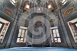 Interior of Nuruosmaniye Mosque showing the Niche Mihrab, marble wall and stained glass windows, an Ottoman Baroque style mosque