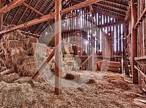 Interior of old barn with straw bales