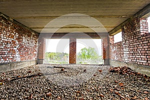 Interior of an old building under construction. Orange brick walls in a new house.