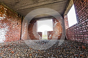 Interior of an old building under construction. Orange brick walls in a new house.