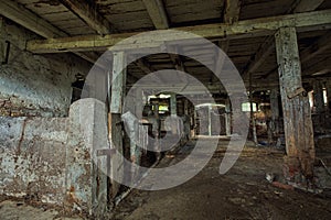 Interior of an old, decaying barn.