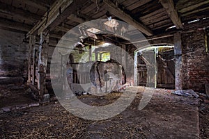 Interior of an old, decaying barn.