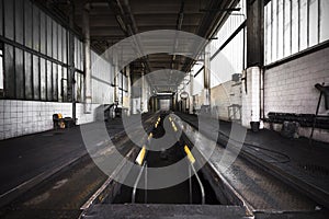 Interior of an old, dirty bus wash building