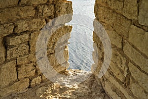 Interior of the old fortress tower. The window embrasures, thick walls.