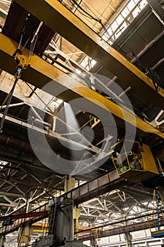 The interior of an old manufacturing plant. Large hangar in a factory with many special machines and technological