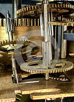 The interior of the old model wall clock is from vintage times. for time and nostalgic narratives. gears inside the clock.