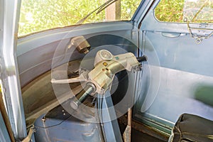 Interior of an old three-wheeled single-seater vehicle