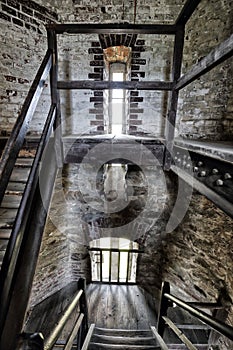 Interior of the old tower with wooden stairs photo