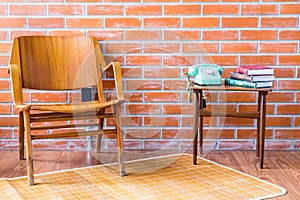 Interior with old vintage brick wall  with armchair and wood side table