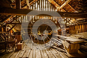 Interior of old wooden shed with scrap wood with sunrays photo