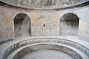 Interior of one of the bathrooms in Stabian Baths Pompeii, Italy with partially preserved frescoes