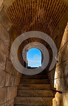 Interior of one of the entrances to the stands of the old Roman Theater of Merida, with a brick arched ceiling with granite