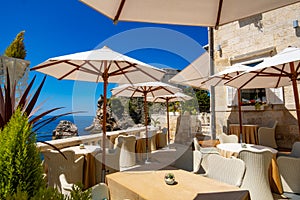 interior of an open air restaurant on the street of the old town, vintage architecture, the concept of traveling through the