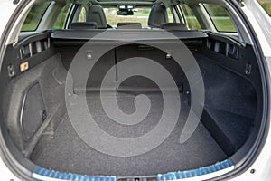 Interior of the opened empty car trunk during the daytime