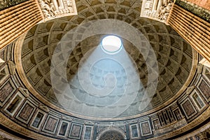 Interior Pantheon dome with sunlight shining in Rome