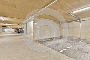 the interior of a parking garage with a brick floor