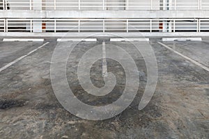 interior of parking garage with car and vacant parking lot