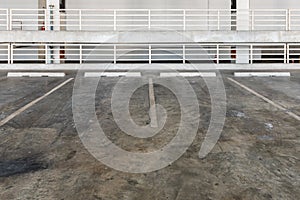 interior of parking garage with car and vacant parking lot