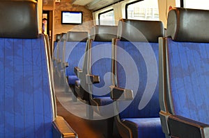 Interior of passenger train with empty seats
