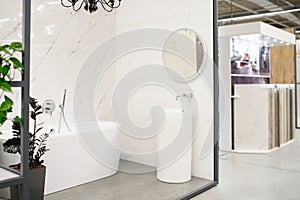 Interior photography of plumbing establishment where tiles, bathtubs, furniture and toilets are sold