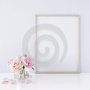 Interior poster mock up with vertical wooden frame and flowers in vase on white wall background 3D render