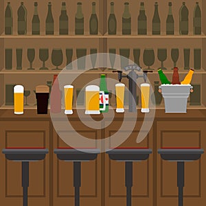 Interior of pub, cafe or bar with counter, glasses of beer, beer pump and ice pail. Inside drinking establishment.