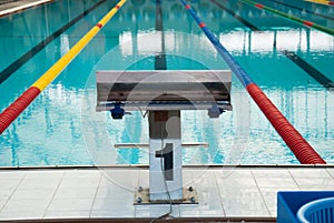 Interior of public indoor swimming pool with racing Lanes and bl