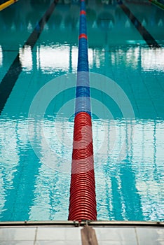 Interior of public indoor swimming pool with racing Lanes and bl