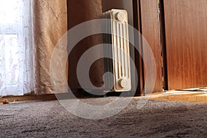 Interior radiator carpet wooden door and low point of view